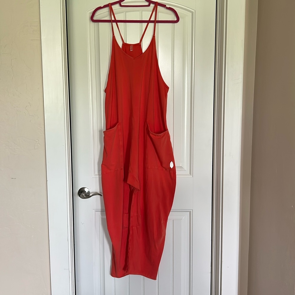 NWOT free people onesie ! Vibrant melon color!